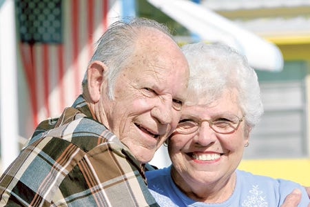 For 14 years David and Alice Wilson haven't been happier than in their second marriage and show their affection in front of their home in Lake Wales.