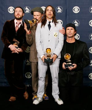 The Red Hot Chili Peppers from left, John Frusciante, Flea, Anthony Kiedis and Chad Smith pose with their awards at the 49th Annual Grammy Awards in February. The band on Monday, Nov. 19, 2007 sued Showtime Networks over the name of the television series "Californication," which is also the name of the band's 1999 album and a single on it.