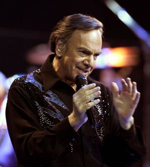 Singer Neil Diamond performs, Aug. 18, 2005, at Madison Square Garden in New York. Diamond held onto the secret for decades, but he has finally revealed that President Kennedy's daughter was the inspiration for his smash hit "Sweet Caroline."