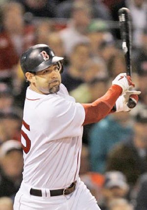 Mike Lowell and the Red Sox finalized his three-year, $37.5 million contract Tuesday.