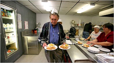 John Cox Sr. serves free lunches at a subsidized apartment complex for the elderly in Machias.