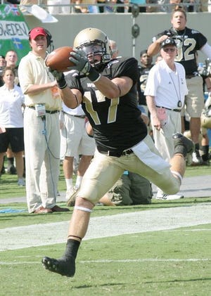 Wofford's Andy Strickland keeps his eye on the ball as he catches a long pass for a score in their game against Appalachian State earlier this season.