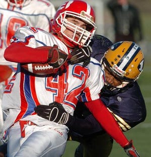 Ledyard's Denzel Allen, right, brings down Berlin's Andrew Hornberger, left, Saturday, Dec. 1, 2007 in the second quarter of their Class M Football Championship game in New Britain.At the half Berlin is leading 14-7.
