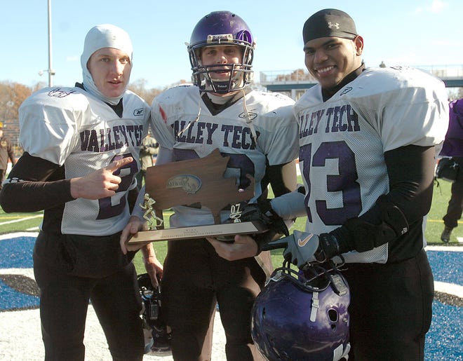 Valley Tech captains, from left, Aron Sweder, Bobby Pizzarelli and Juan DeLeon hold their trophy after winning the Div. 3 CMass/WMass Super Bowl.