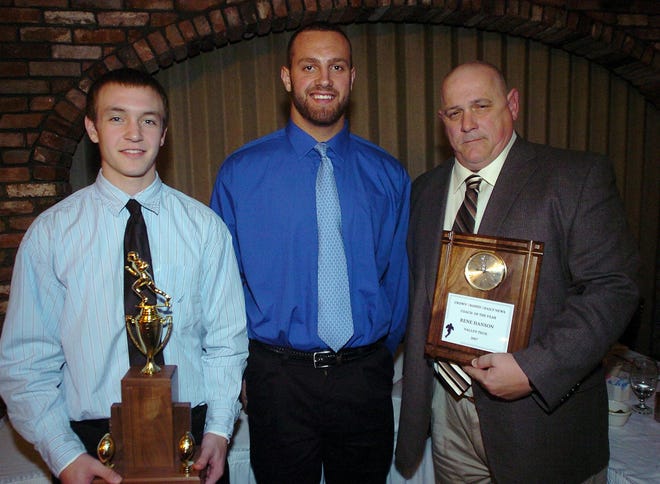 Boston College linebacker Mark Herzlich, who was the keynote speaker at the Crown Trophy/Daily News High School Football Banquet, poses with Player of the Year Josh Carter (left) and Coach of the Year Rene Hanson (right).