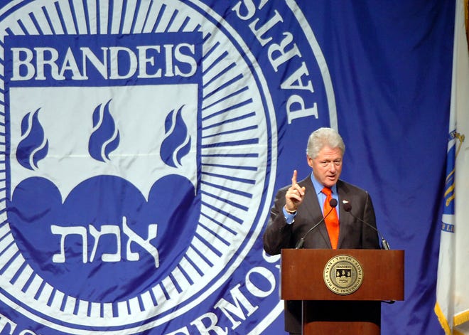 Former President Clinton speaks at Brandeis University yesterday.