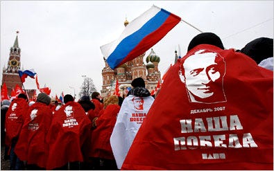 Members of Nashi, a pro-Kremlin youth group, celebrated in Moscow Monday after an overwhelming victory by President Vladimir V. Putin’s party, United Russia, in Sunday’s elections. The slogan below the image of Mr. Putin means “our victory.”