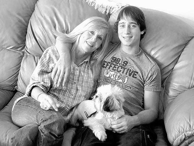 Filia Koellhoffer and her son, Derrick, sit in their Bradenton home with their dog, Toby. Filia Koellhoffer, a former accountant, says she wants a job but no one wants to hire her. Her son works two jobs.