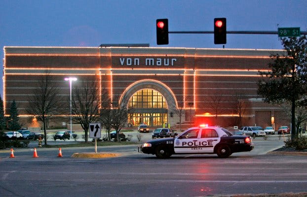Police vehicles Thursday, Dec. 7, block the entrance to the Westroads Mall, site of Wednesday’s deadly shooting, in Omaha, Neb. Eight people were killed and five wounded before the shooter, Robert A. Hawkins, killed himself.
