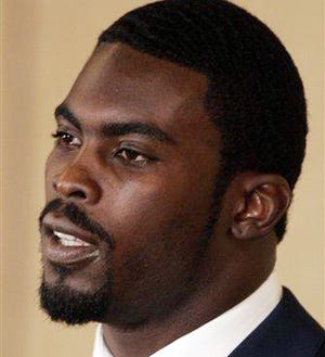 Michael Vick makes a statement after pleading guilty to a federal dogfighting charge in Richmond, Va., in this Aug. 27 file photo.