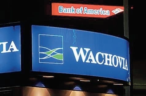 Wachovia and Bank of America, along with PNC, reported bigger-than-expected writedowns and said fourth-quarter results could be down.