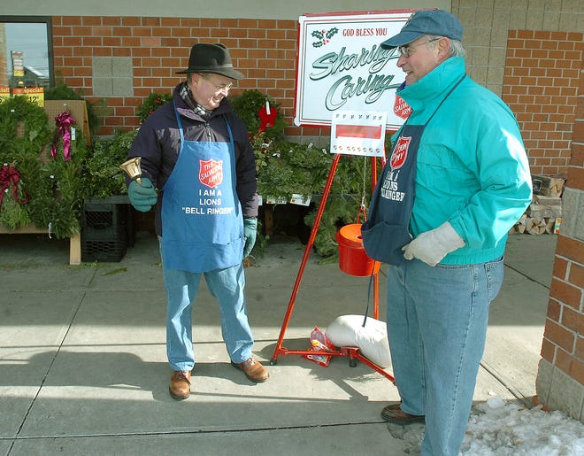 Hopedale Lions Club members Joe Hughart and Dave Ferreira volunteered their time as bell ringers for the Salvation Army yesterday in Milford.