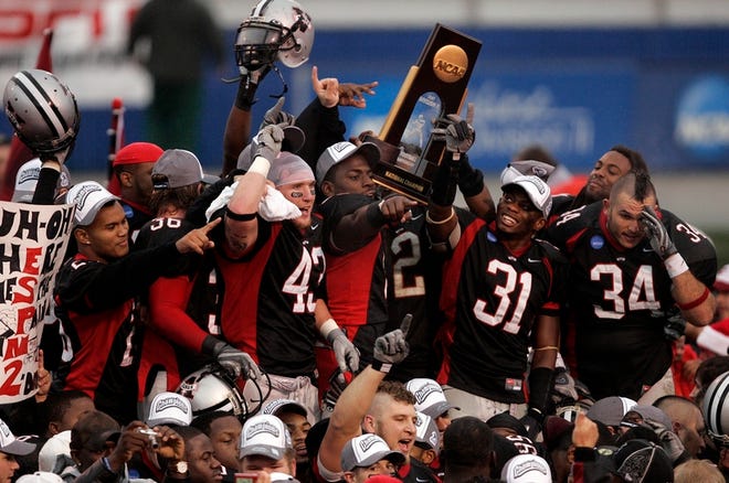 Valdosta State players, including former St. John Lutheran star Donnie Powell (far left), celebrate the Blazers' NCAA Division II championship on Saturday. Valdosta State defeated Northwest Missouri State in Florence, Ala., to complete a 13-1 season.