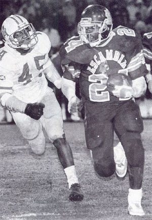 Emmitt Smith runs the ball for Escambia High School in Pensacola in the 1980s. The college and NFL great was named Florida's No. 1 prep football player for the 100 years of the game in the state.