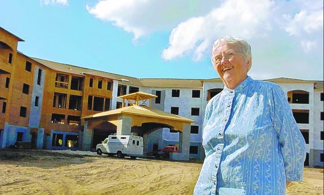Water's Edge resident Betty Strock says she is looking forward to moving into The LakeHouse when it is completed in April 2008. Some seniors who want to move in are having trouble selling their homes in other parts of the country.