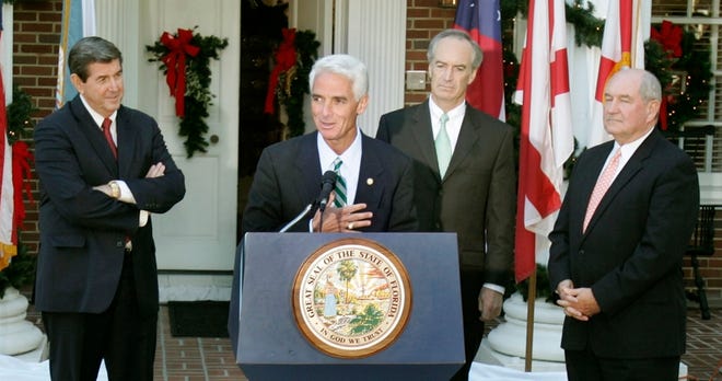 Gov. Charlie Crist, center, addresses the media following a Southeast water meeting with governors from Alabama and Georgia.