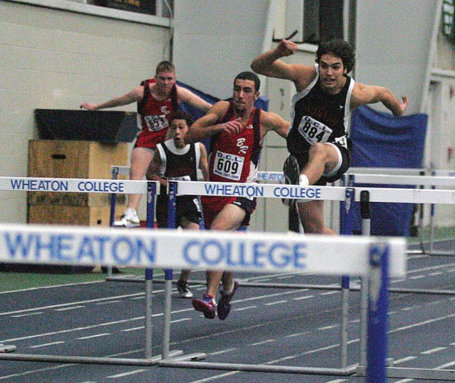 Members of the B-R and Taunton High track teams jump hurdles in their meet Tuesday.
