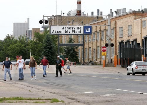 Employees leave the General Motors assembly plant in Janesville, Wis., in June of 2005, for their lunch break.
