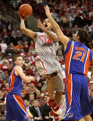 Ohio State's Jamar Butler (14) drives to the basket past Florida's Dan Werner (21) during the second half of their college basketball game Saturday, Dec. 22, 2007, in Columbus, Ohio. Ohio State won, 62-49.