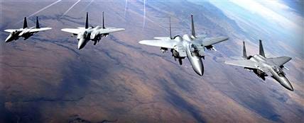 This October 2005 photo shows a group of U.S. Air Force F-15 aircraft flying in formation near Mountain Home Air Force Base, Idaho. The Air Force grounded about 450 F-15s after one of the fighters began to break apart in the air and crashed Nov. 2, 2007 in Missouri.