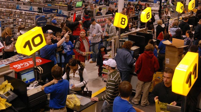 Shoppers pack the checkout aisles at Best Buy in Framingham on Wednesday.