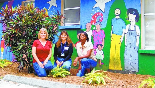 From left, Trish McNally, Master Gardener director Lisa Hickey and Brenda Freeman, Anna E. Gayle Resource Center manager.