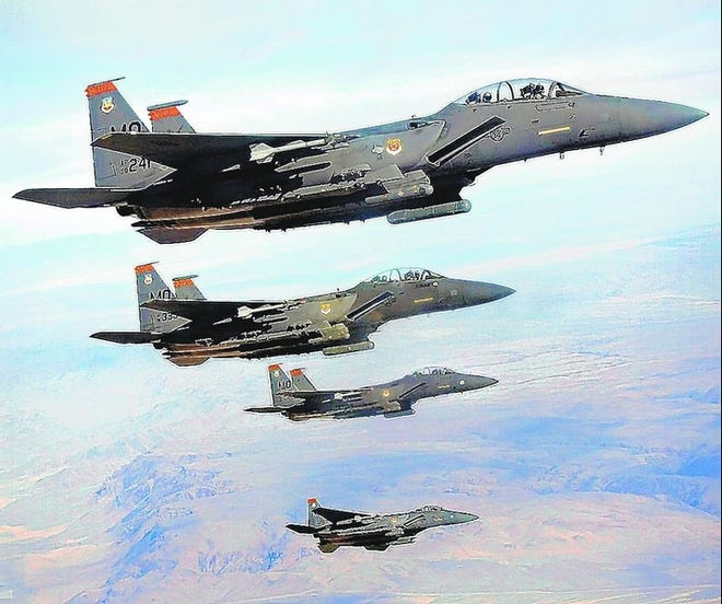 This 2005 photo shows a group of U.S. Air Force F-15 aircraft in formation during a training mission at Mountain Home Air Force Base in Idaho. It is not clear when the F-15s will be allowed to fly again.