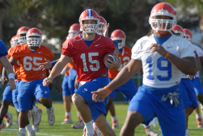 Florida QB Tim Tebow, center, leads teammates through stretching exercises during Wednesday's practice for the Capital One Bowl.
