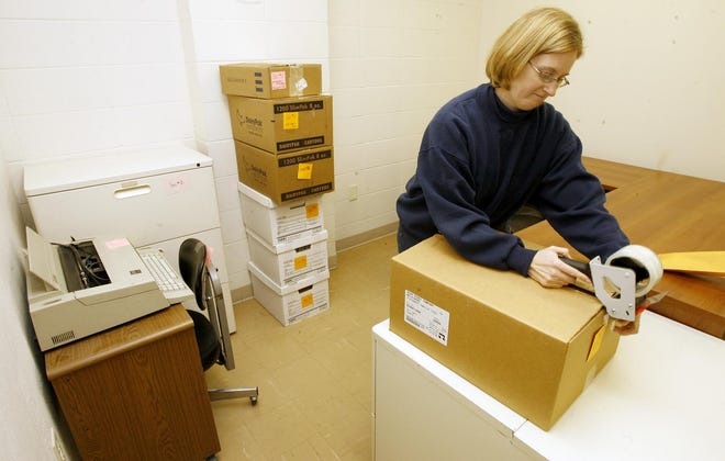 Kelli Morrow, secretary at the University of Illinois Extension Office, makes last-minute preparations Dec. 28, 2007, for the move from 930 W. Locust Street to the new office at 915 Alexandra Drive in Belvidere.