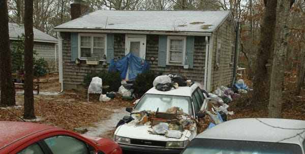 Ann Biglin's Nauset Road home in West Yarmouth was so full of junk that the town was forced to condemn the property in order to help her.