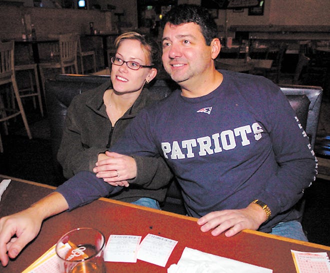 Jay DeVincentis and Rebecca McGuirk, from Franklin, watching Dallas vs. Washington game at Doc's.