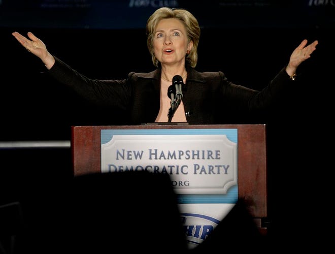 Democratic presidential hopeful,Sen. Hillary Rodham Clinton, D-N.Y. acknowledges the cheers of supporters as she takes the stage at the New Hampshire Democratic Party's 49th annual 100 Club dinner in Milford, NH., Friday night, Jan. 4, 2008. New Hampshire's first in the nation presidential primary is Tuesday Jan. 8, 2008. (AP Photo/Stephan Savoia)