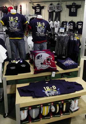 The Bob's Store on Route 44 in Raynham features a slew of hats and t-shirts commemorating the Patriots' perfect 16-0 regular season.