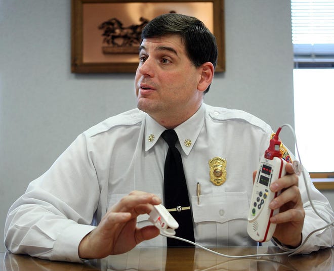 Framingham Assistant Fire Chief John Magri demonstrates the department's new carbon monoxide poisoning meter.