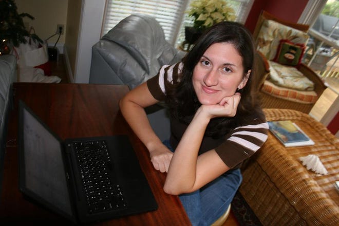 Lisa Timmons, editor of celebrity gossip blog A Socialite's Life, worked on her laptop computer in her mother's Richmond Hill home during the Christmas holidays.