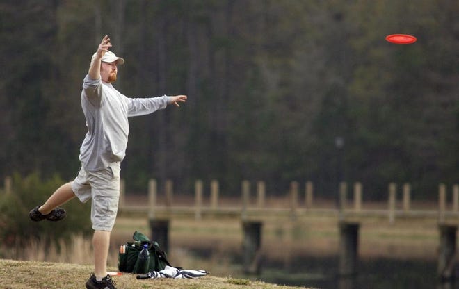 Josh Childs throws a tee shot Saturday during the Savannah Open disc golf tournament, held at Tom Triplett Park in Pooler. (Carl Elmore/Savannah Morning News)