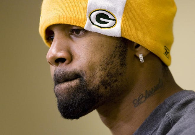 Green Bay Packers cornerback Charles Woodson pauses during a news conference Jan. 16, 2008, in Green Bay, Wis. Although it all worked out in the end, the truth is that Woodson didn’t really want to play in Green Bay.