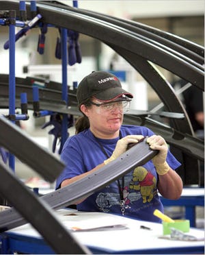 Lori Reneau of C&D Zodiac in Marysville, Wash., one of Boeing’s suppliers, working on fuselage parts for the 787.
