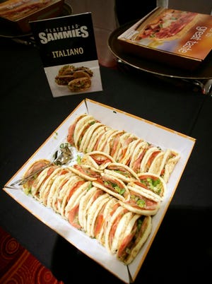 The Italiano variety of Quiznos' Sammies is offered during a lunch break at Quiznos' annual companywide meeting in Denver in this photograph taken on Monday, Dec. 3, 2007. The Sammies is part of management strategy to improve sales for the chain for 2008. (AP Photo/David Zalubowski)
