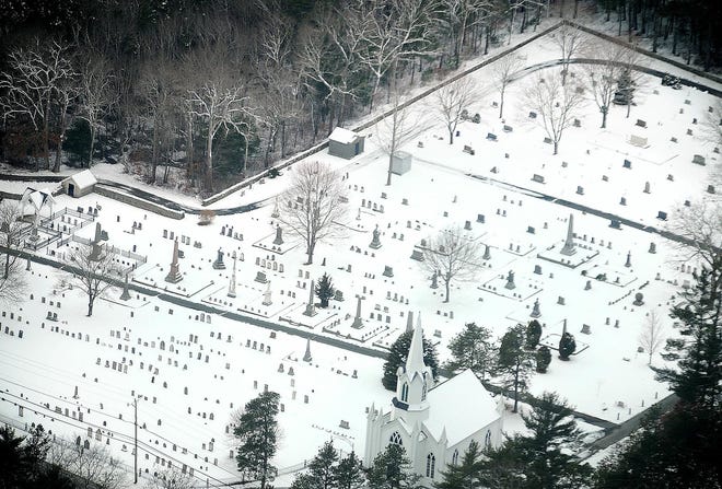 A blanket of snow covers the graves in the cemetery near Union Church in Carver.