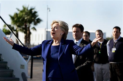 Democratic presidential hopeful, Sen. Hillary Rodham Clinton, D-N.Y. remarks on the weather as she arrives at the airport in Sarasota, Fla. Sunday, Jan. 27, 2008 to attend a fundraising event.
