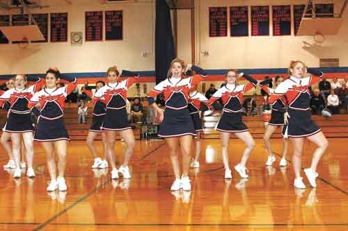 The Penn Yan Mustangs varsity cheer squad strikes a pose during a routine at a recent varsity basketball game.