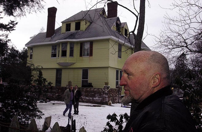 Ronnie Harnois, who was asleep in the house when the fire started, reflects on the damage.