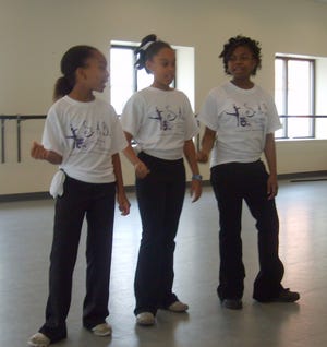 Christiana Horn (from left), 9, Jada Lowery, 10, and Latrease Cooks, 12, perform a Broadway song at Cutno Dance Center.