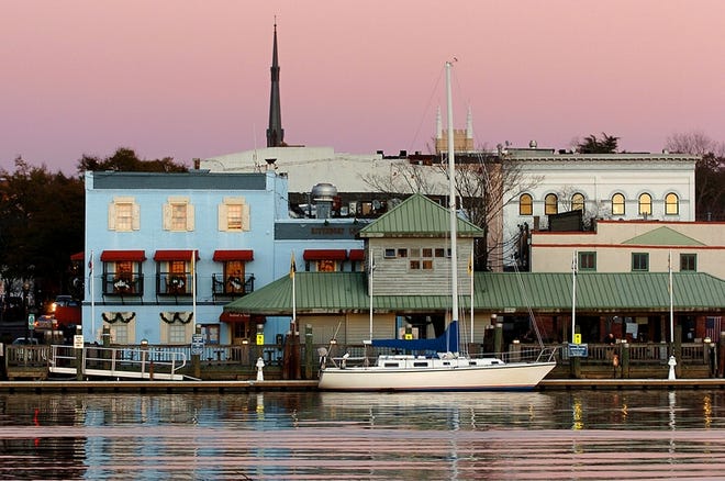 A colorful sunset creates a postcard perfect view of Water Street in downtown Wilmington.