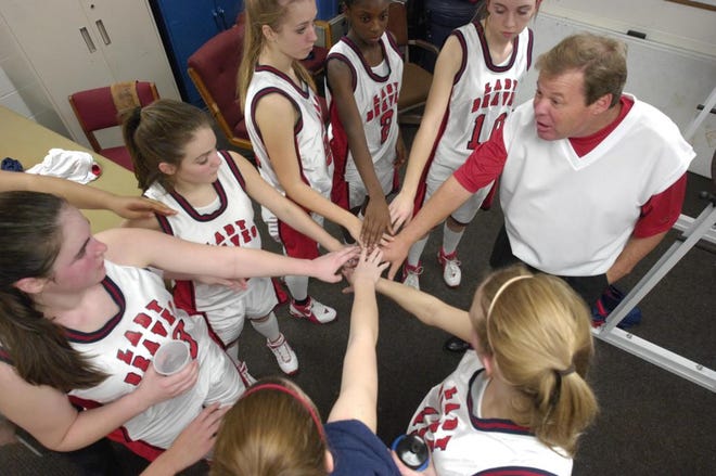 Bible Baptist girls basketball coach Kenny Conroy gets his team ready for the second half of a recent game. Bible Baptist is one of the city's smaller schools with an athletics program. (By Hunter McRae/Savannah Morning News)
