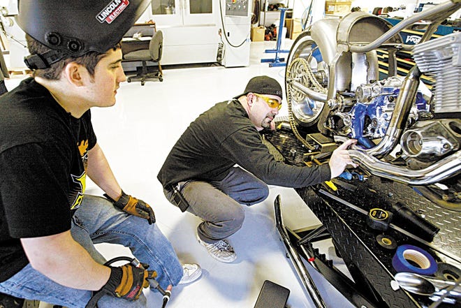 Cody Connelly, left, and Vinnie DiMartino, both formerly of Orange County Choppers, work on V-Force Customs’ first bike. DiMartino left the successful motorcycle builders to open V-Force, his own custom shop in Rock Tavern, so he could be his own boss.