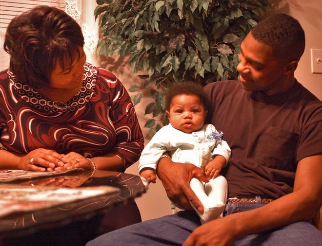Nate and Sheilar Carter with their son, Chamar, 3 months.