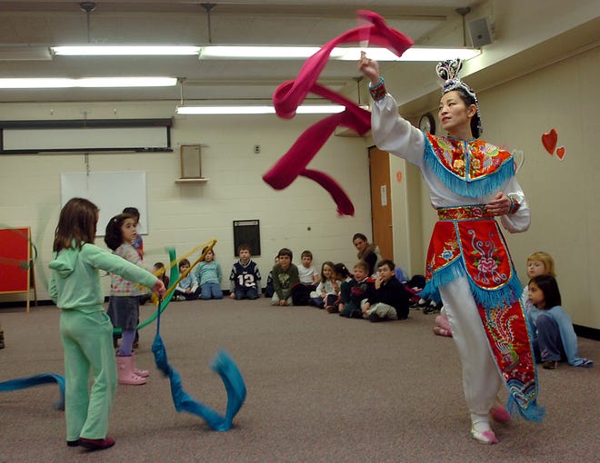 Chiao Bin Huang, of Carlisle, teaches traditional Chinese ribbon dancing to children at the Westwood Public Library to celebrate the Chinese New Year. February 7 marks the year of the Rat.