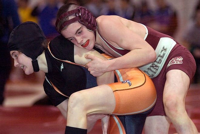 Killingly's Tom Lombardi tries to take down Montville's Jessica Bennett in the 103 lbs division of the class S tournament Saturday at St. Bernard.